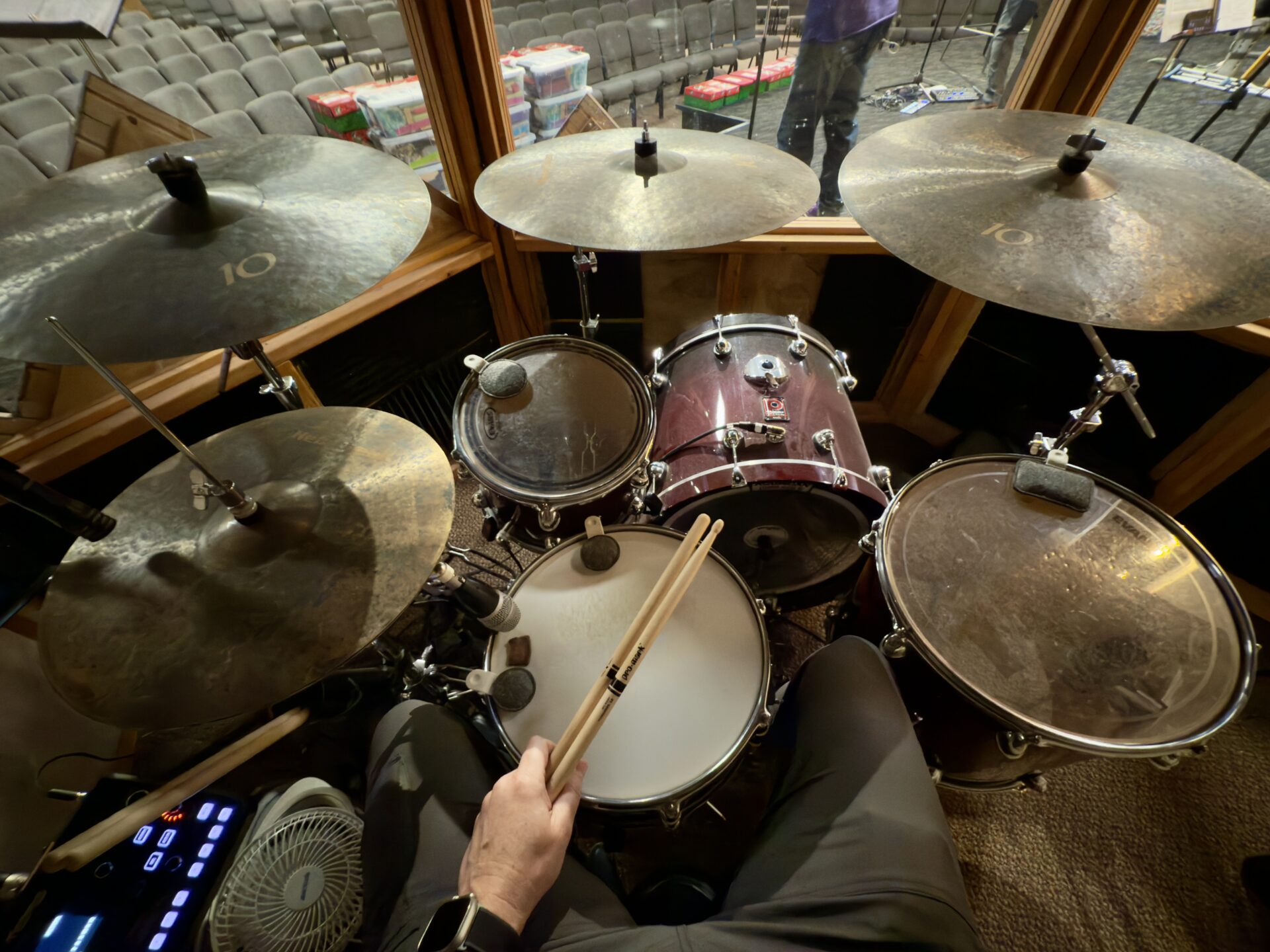 Rehearsing to play drums live at church